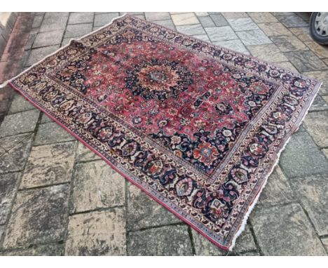 A Persian type red ground carpet, 318 cm x 240 cm