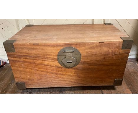 A Chinese teak and brass bound chest, on castors, 104 cm wide