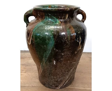 A large glazed pottery two handled urn, 60 cm high