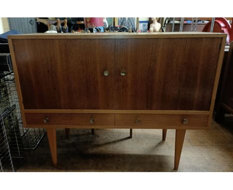 A 1970s/80s dining room suite, comprising a sideboard, 164 cm, an extending dining table and six dining chairs (8)Some thread