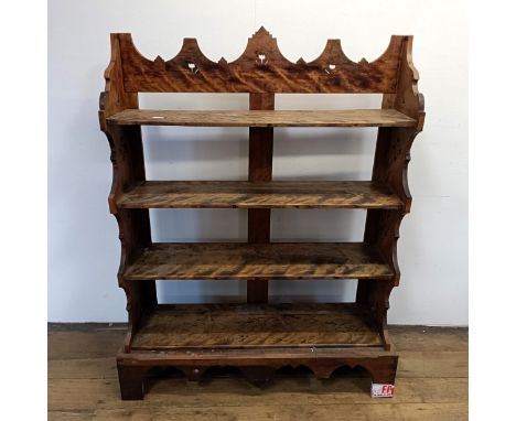 A walnut bookcase, with carved decoration, 97 cm wide