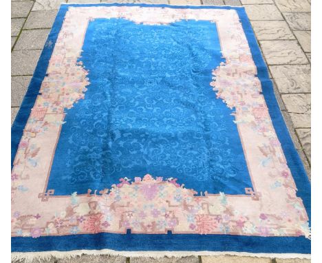 A large Chinese carpet, decorated flowers and foliage, 336 x 242 cm