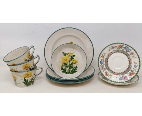 A Wemyss cup and saucer, decorated buttercups, two matching cups and three plates