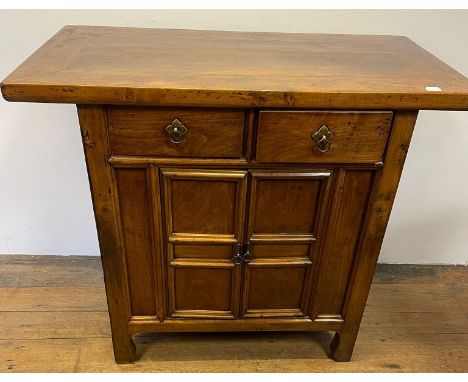 A Chinese elm side cupboard, having two drawers and two cupboard doors, 112 cm wide