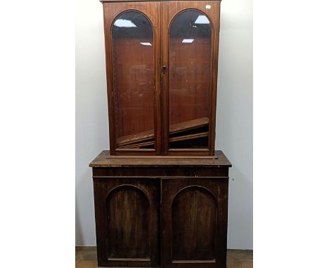 A mahogany bookcase on cabinet, 100 cm wide