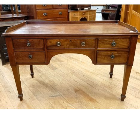 A mahogany dressing table, with five drawers, 125 cm wideRaised back, various losses, some bits of it off