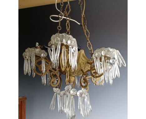 A brass chandelier, with glass drops  Provenance:&nbsp; Sold on behalf of Tenovus Cancer Care