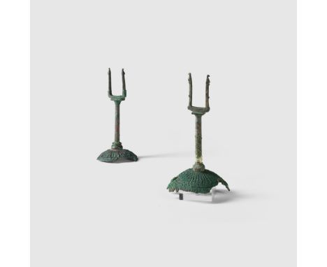 PAIR OF PILOS HELMET FORKS GREECE, C. 3RD CENTURY B.C. cast and hammered bronze, both standing on a conical base with ridged 