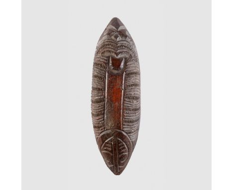 MAORI CONTAINER NEW ZEALAND carved wood and paua shell, possibly a receptacle for tattooing ink, canoe shaped, the underside 