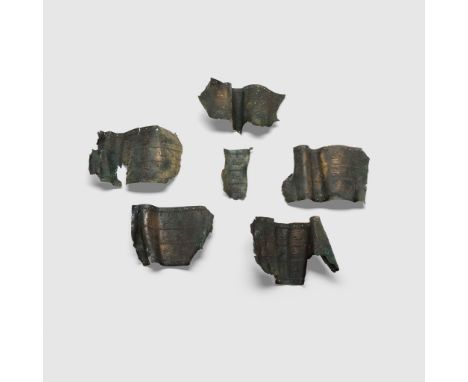 URARTIAN BELT FRAGMENTS URARTU, IRON AGE, C. 7TH CENTURY B.C. engraved bronze, each with incisions along the border for attac