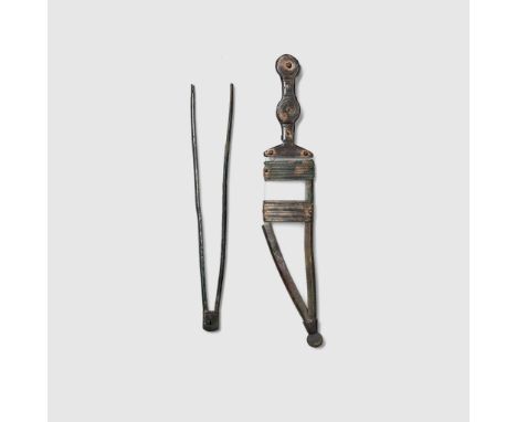 CELTIBERIAN DAGGER AND SHEATH EDGE IBERIA, 500 - 300 B.C. bronze, with circular pommel, the handle formed of two pieces rivet