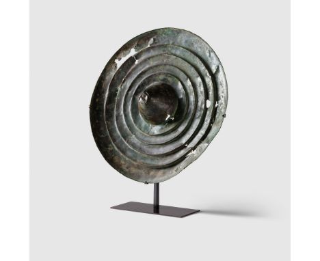 LURISTAN SHIELD NEAR EAST, 8TH CENTURY B.C. hammered bronze, of circular form with a series of concentric ridges leading to a