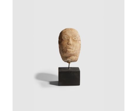 ROMANO CELTIC HEAD WESTERN EUROPE, C. 1ST CENTURY B.C. - 1ST CENTURY A.D. carved stone, with unembellished incised features, 