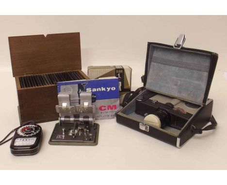 Box of glass lantern slides Sankyo 8cm camera, splicer, western meter and three photographs Condition report: see terms and c