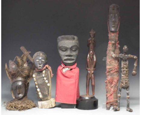 Six African figures carved in various tribal styles, the largest measures 64cm high     All lots in this Tribal and African A