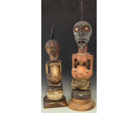 Two Songye Nkisi Power figures or Fetishes, the largest measures 104cm overall height.     All lots in this Tribal and Africa