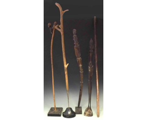 African walking stick carved with a head possibly Lobi, also another figural staff, a stick carved with patterns, a plain wal