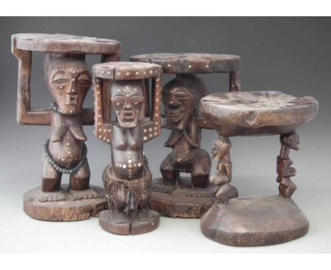 Four Songye caryatid stools carved with Nkisi power figures,  the largest measures 44cm high.    All lots in this Tribal and 