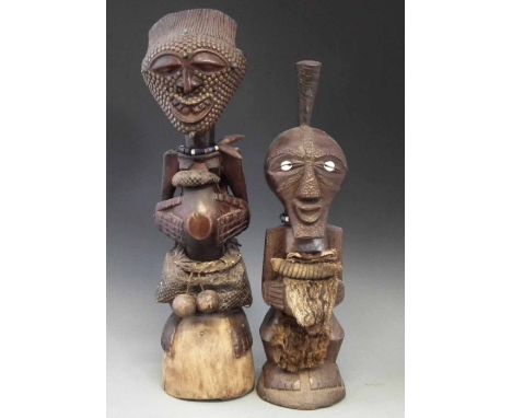 Two Songye Nkisi Power figures or Fetishes, the largest measures 61cm overall height.     All lots in this Tribal and African