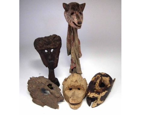 Five African masks carved in various tribal styles, the tallest measures 36cm high     All lots in this Tribal and African Ar