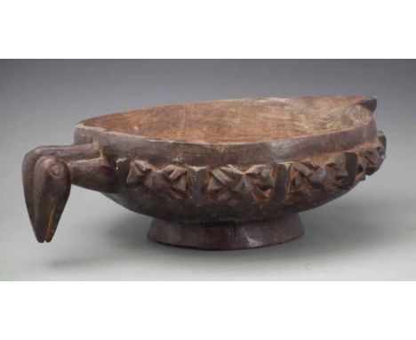 Bamileke bowl, carved with a bird head and pouring spout, 53cm wide     All lots in this Tribal and African Art Sale are sold