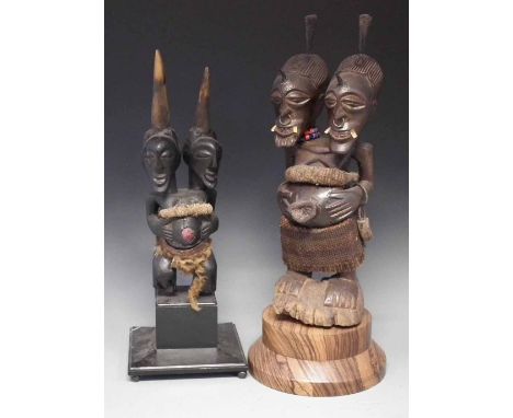 Two Songye double headed Nkisi power figures, the tallest measures 47cm high     All lots in this Tribal and African Art Sale