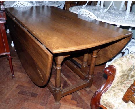 18th century oak gate-leg table, replacement oval top with two leaves, base with turned gates and legs united by scratch moul