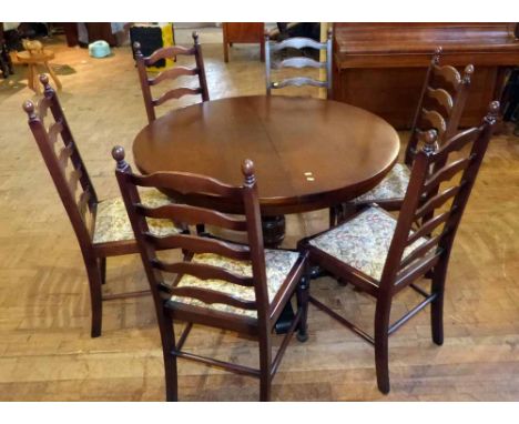 Reproduction oak extending circular dining table and 6 ladder-back chairs Condition report: see terms and conditions