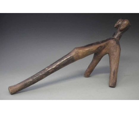 Lobi Daaka three legged stool, carved with three faces, 65cm long    All lots in this Tribal and African Art Sale are sold su