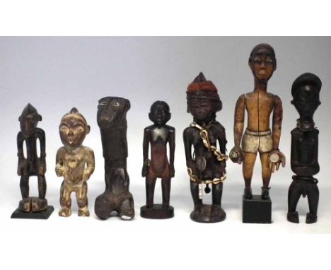 Seven African figures carved in various tribal styles, the tallest measures 30cm high     All lots in this Tribal and African