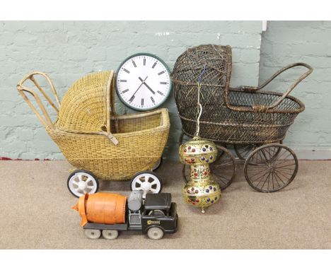 Two basketware dolls cribs along with a metal lantern, wall clock and vintage toy truck.