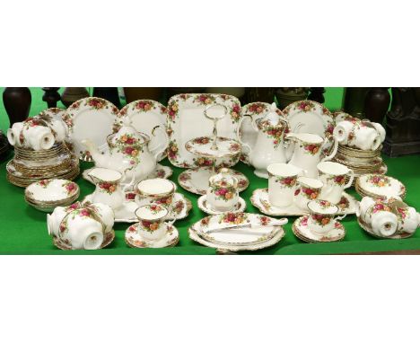 A Royal Albert comprehensive tea service decorated in the old country roses pattern approximately 90 pieces.