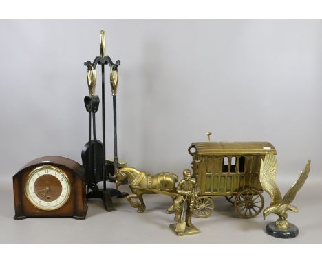 A collection of brassware to include horse and carriage, mine worker, eagle and a companion set along with a Smiths oak cased