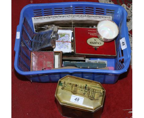 A basket of collectables, enamel badges, old tins, childrens wristwatches, pewter hip flask etc.