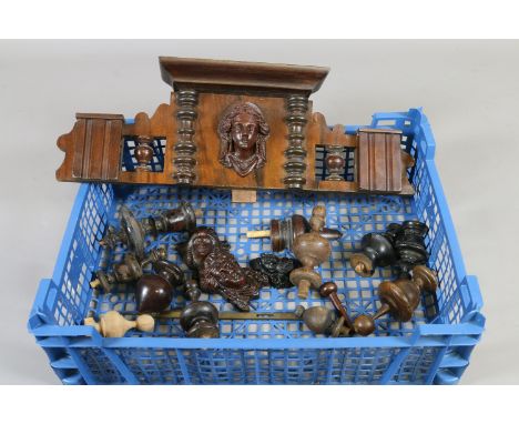 A tray containing a quantity of wall clock parts to include mask carved frieze piece, pendulum pieces and a quantity of finia