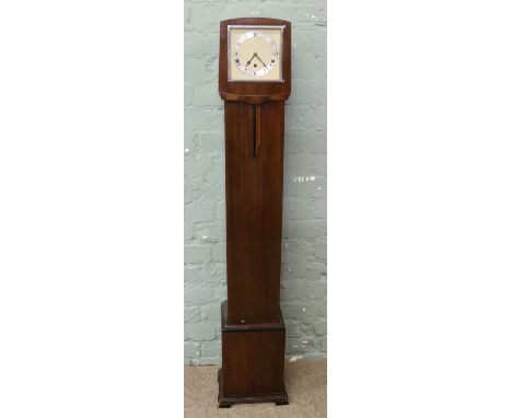 A Garrard mahogany cased Art Deco granddaughter clock with silvered chapter ring, incorporating Westminster quarter strike.