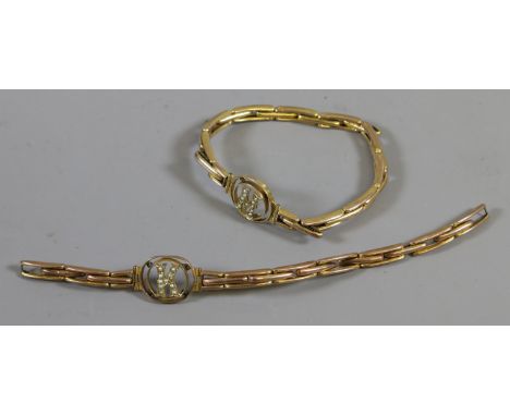 A pair of 9ct gold bracelets with expanding links, each with a seed pearl set letter K & M one (AF) 14.06 grams gross weight.