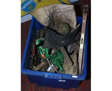 A box of various tools to include spirit level pliers and Stilson type grips etc.