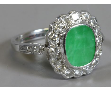 A boxed ladies hallmarked 18ct white gold jade and diamond cluster ring, size M.