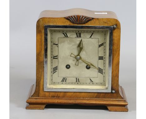 A French walnut mantel clock. The Roman numeral dial encloses square eight day two train movement.
