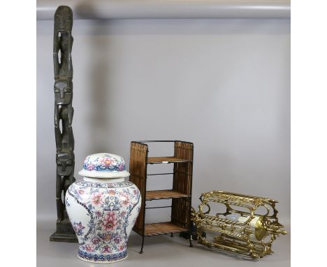 A pottery baluster Chinese style lamp base, brass lantern, small bamboo CD shelf and an African tourist ware carving.