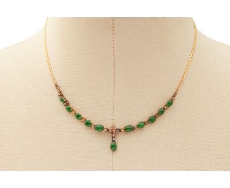 A JADE CABOCHON AND DIAMOND NECKLACE
From the collection of a prominent Singapore businesswoman
A necklace set in 14k yellow 