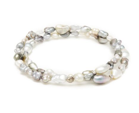A KESHI PEARL BANGLE A Keshi pearl bangle made up of 56 pearls   The pearls measure 2-5+mm 35cm long