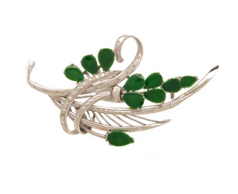 A JADE FOLIATE SPRAY BROOCH
From the collection of a prominent Singapore businesswoman
set within a white gold frame with dia