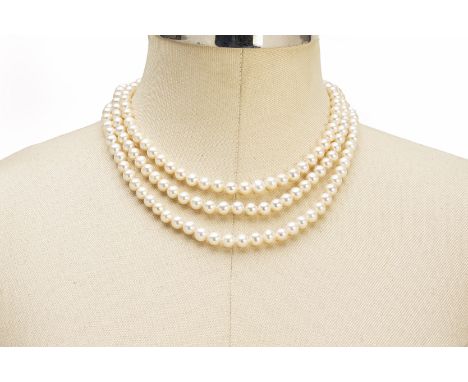 A THREE STRAND PEARL NECKLACE WITH CHINESE CHARACTER CLASPA three strand freshwater cultured pearl necklace to a 14k yellow g