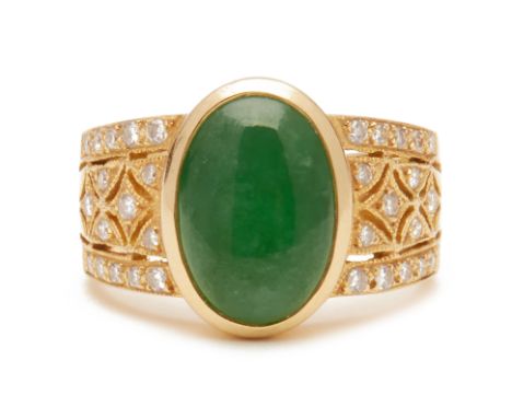 A CABOCHON JADE AND DIAMOND RING An 18k yellow gold and type A cabochon jade and diamond ring  In an antique setting. marked 