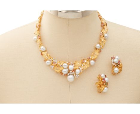 A BAROQUE SOUTH SEA PEARL NECKLACE AND EARRING SET
From the collection of a prominent Singapore businesswoman
set in 18K whit