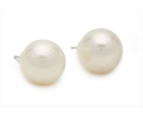 A PAIR OF SOUTH SEA CULTURED PEARL STUD EARRINGS The pearls measuring 12.2 -12.8mm, on gold post fittings
 12.2-12.8mm wide 5