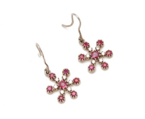 A PAIR OF RUBY AND DIAMOND SNOWFLAKE DANGLE EARRINGS
From a Singapore single-owner collection. Coming in October, from the sa