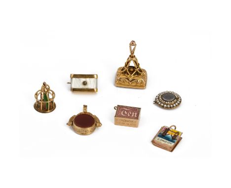 A COLLECTION OF 9K GOLD CHARMS
A collection of 9K gold charms consisting of: a bird cage, a "London" book, a diamond camera p